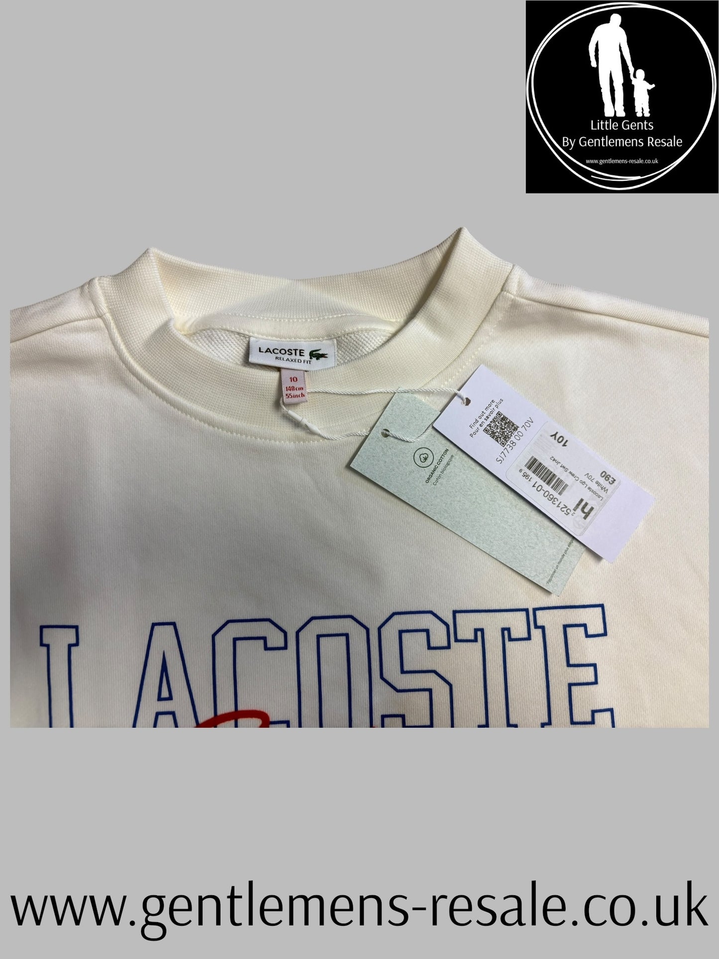 Lacoste shirt with a tag on a gray background