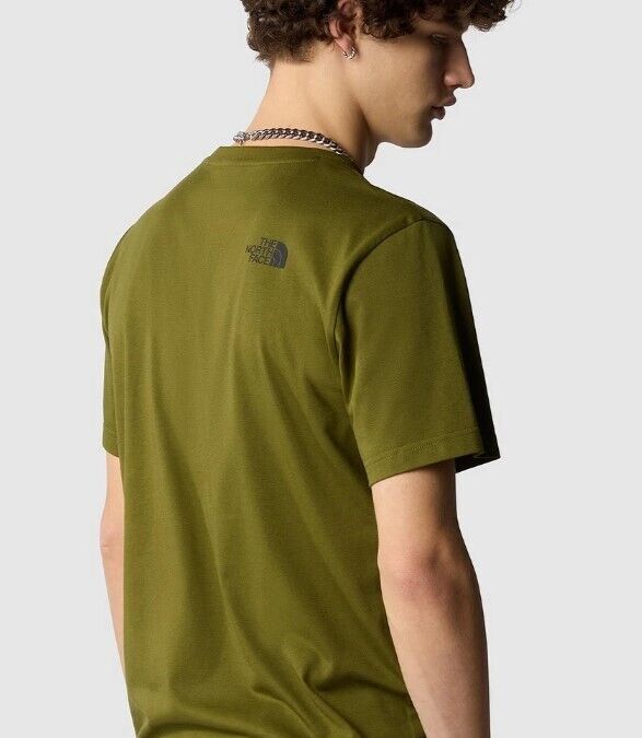 Man wearing olive green The North Face t-shirt, viewed from the back, casual style