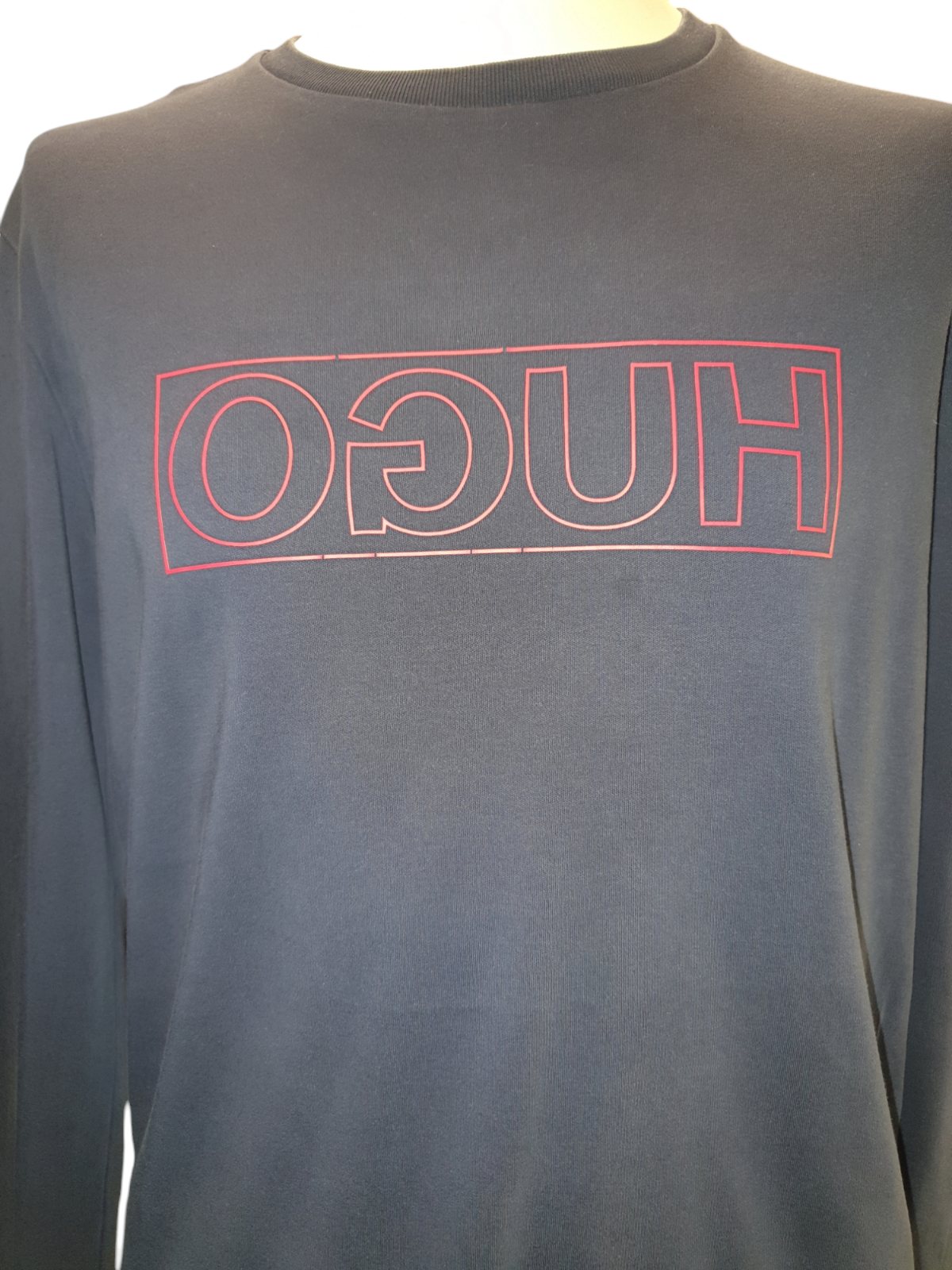 Men's black long sleeve shirt with red outlined logo graphic on chest