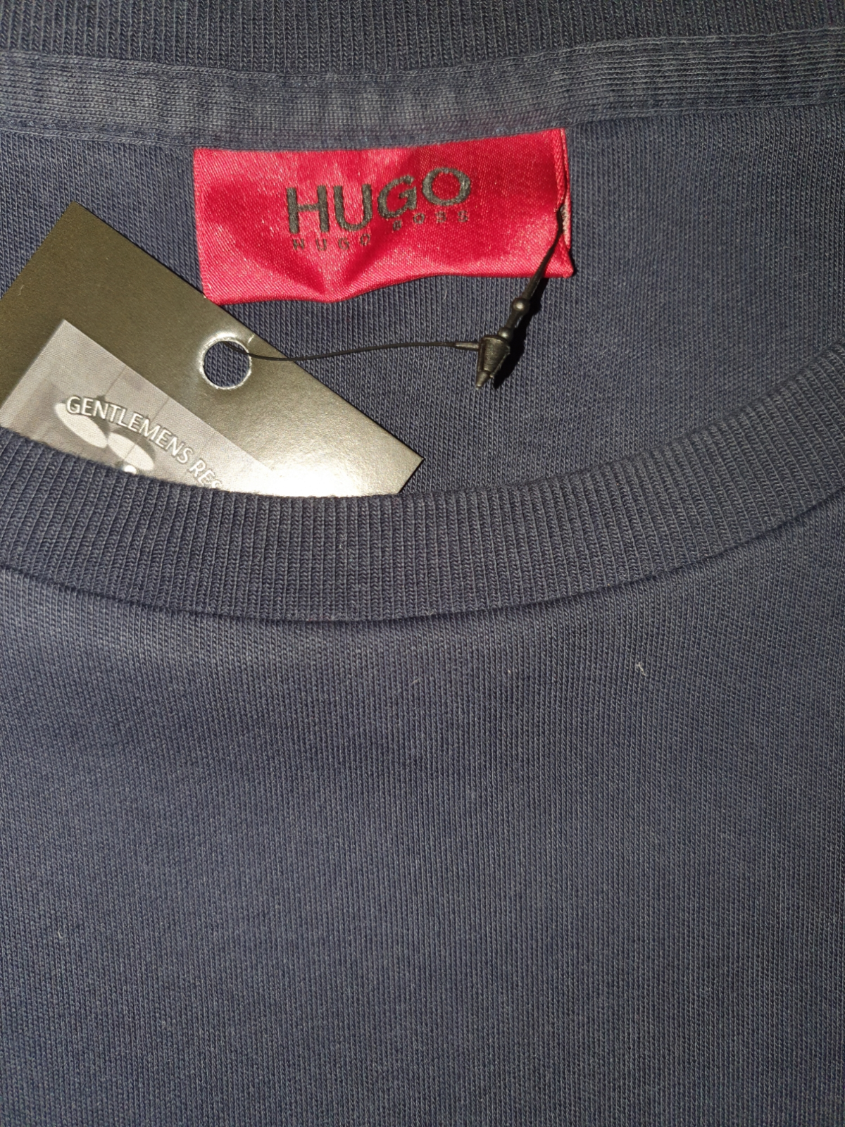 HUGO navy blue crewneck designer shirt with red label and attached tag, luxury menswear