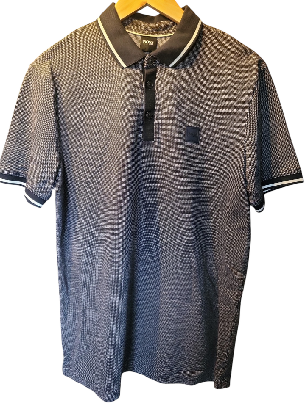 Designer men's navy short sleeve polo shirt with textured pattern and contrast collar