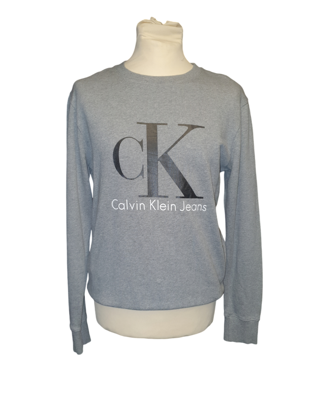 Light grey Calvin Klein Jeans sweatshirt with logo, long sleeves, displayed on mannequin