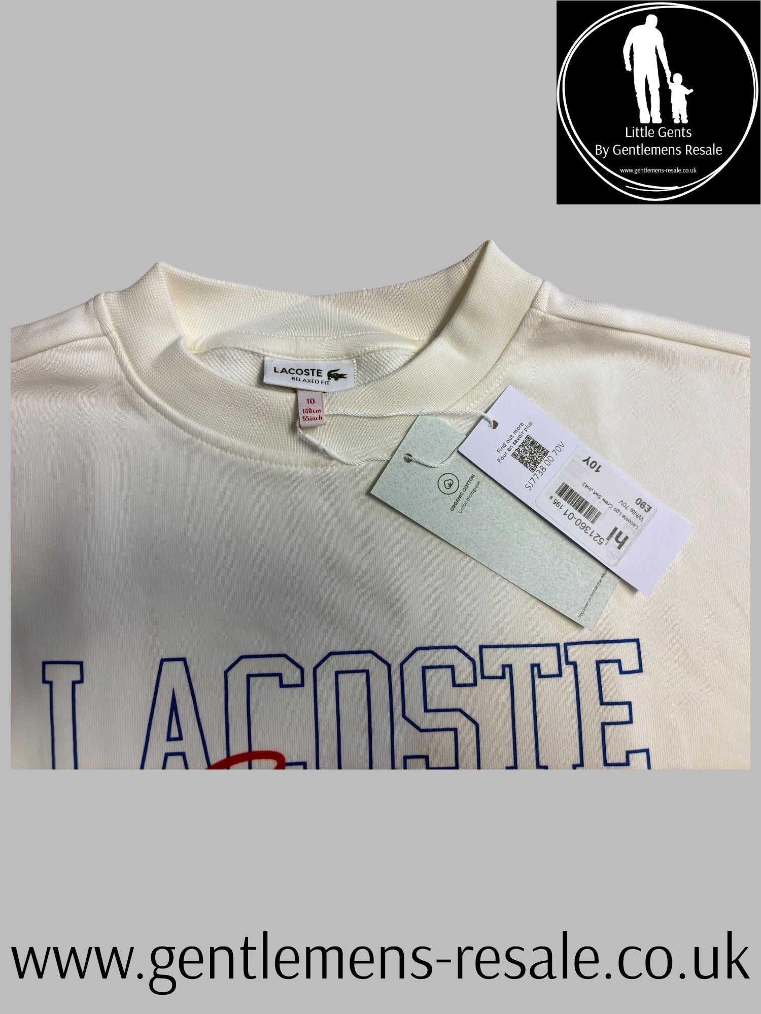 Lacoste shirt with a tag on a gray background